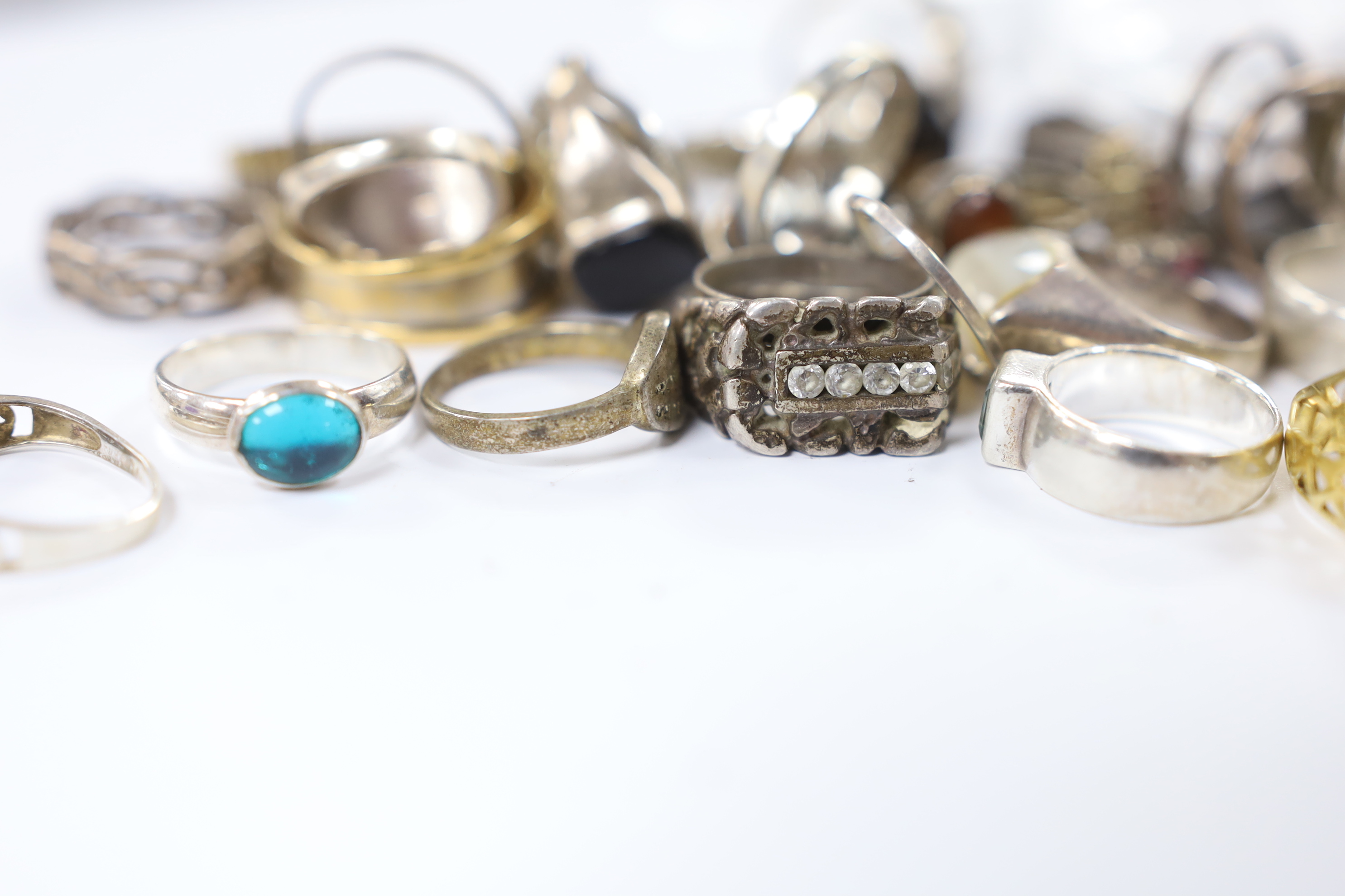 A quantity of assorted mainly white metal and 925 dress rings.